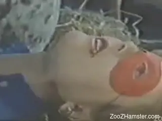 Female with mask has sex with animal in vintage clip