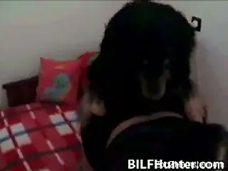 Twin-tailed brunette attracts hound to lick and fuck her twat