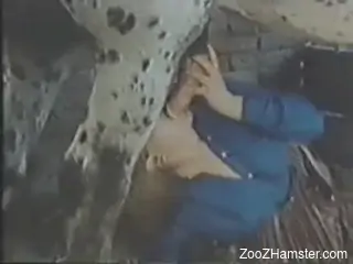 Masked woman is passionately sucking stallion's cock