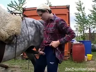 Short-haired chick jerking a huge cock outdoors