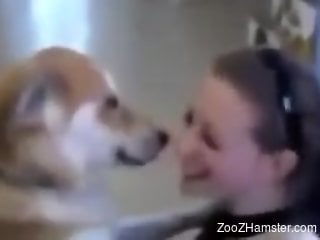 Playful babe making out with a dog just as a joke