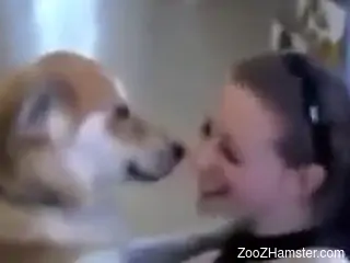 Playful babe making out with a dog just as a joke