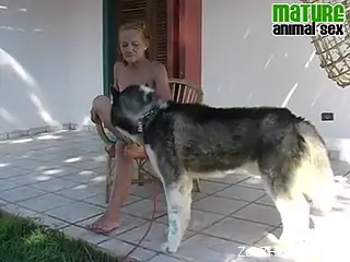 Mature whore is having zoo sex with her Husky